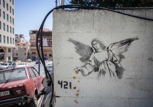 stefano majno israel west bank wall banksy graffiti angel betlehem.jpg.jpg